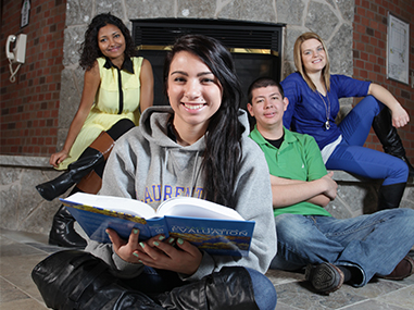 Students near a fireplace