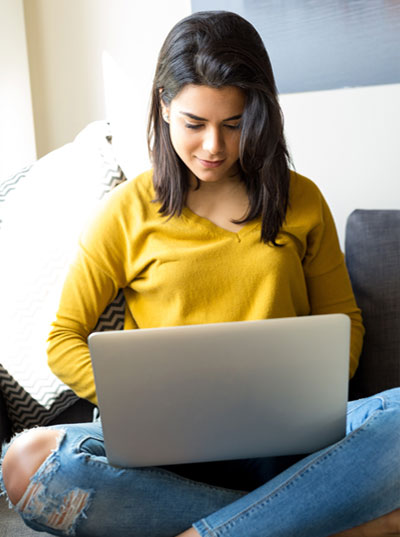 A student using her laptop